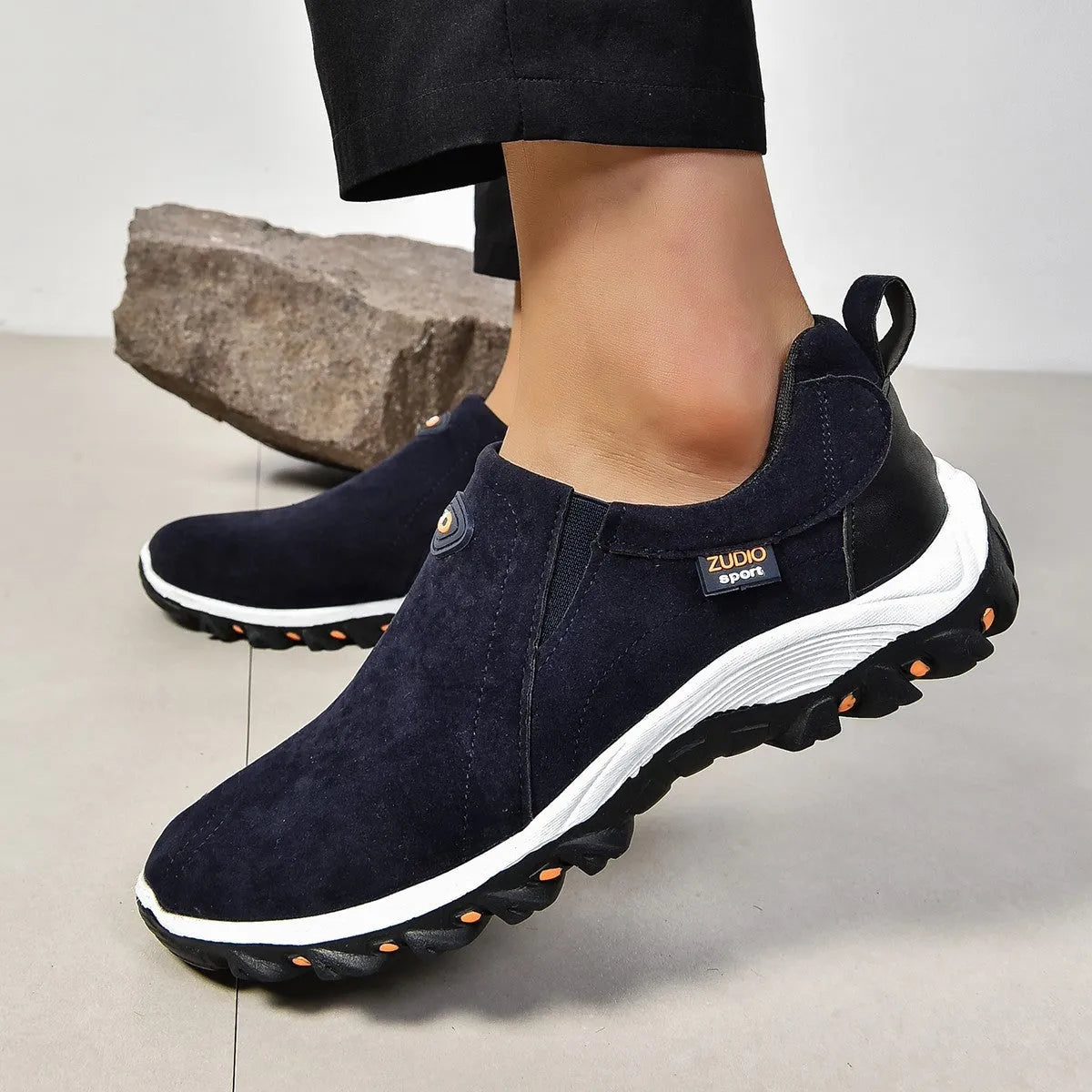 Men's grey PU slip-on overshoes with a round toe and rubber sole, shown on a foot.