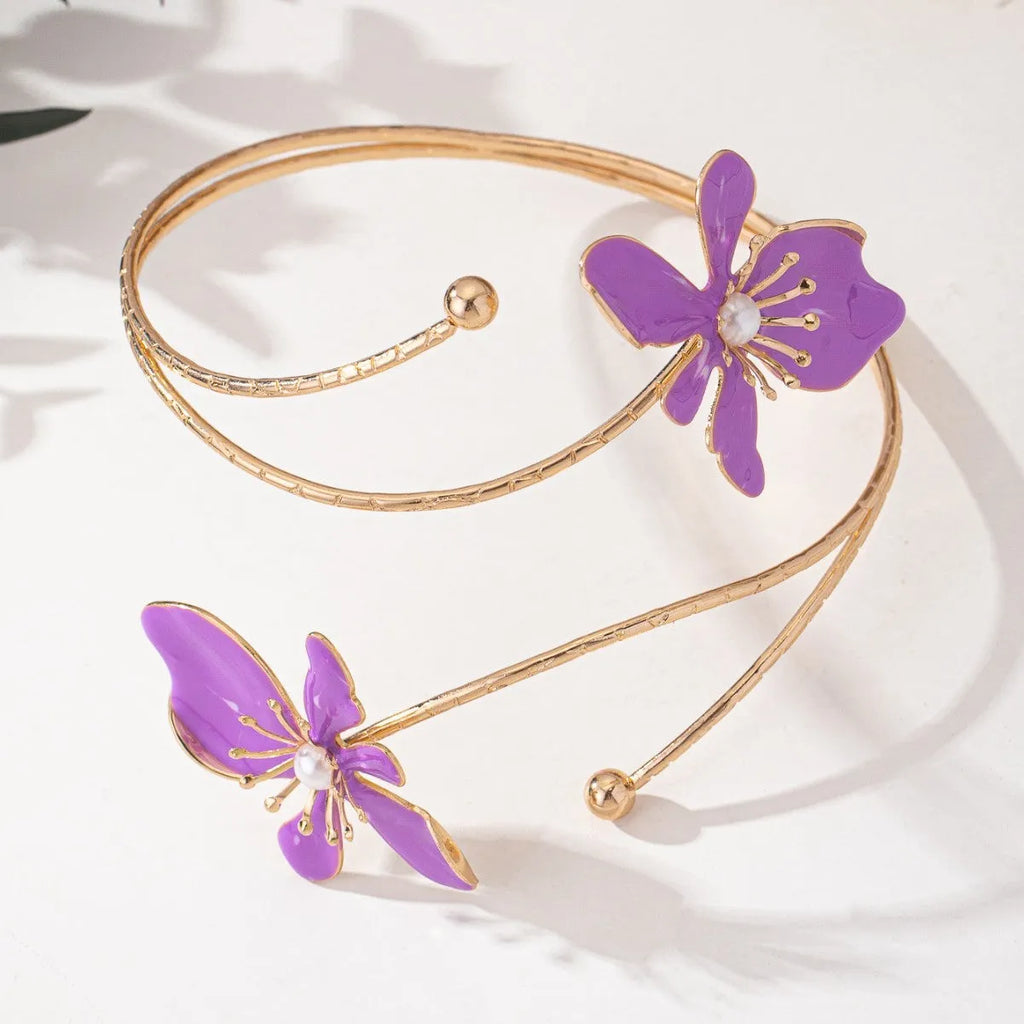 Pink alloy armband with hollow line pattern design on wrist