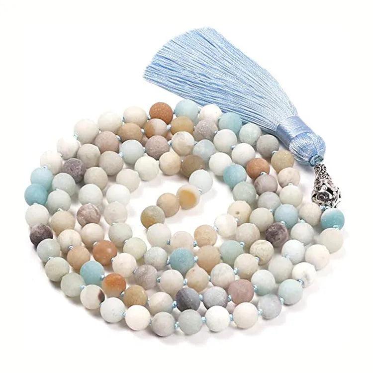 Long multicoloured agate and gemstone tassel necklace with geometric beads.