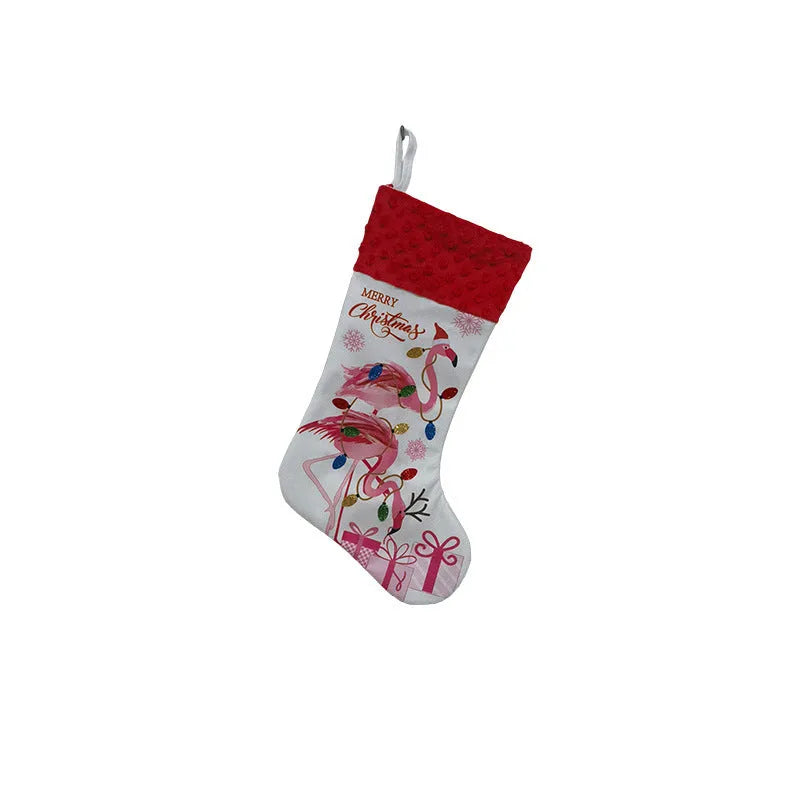 Red and white flamingo print cloth Christmas stocking hanging decoratively.