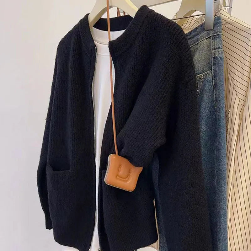 Beige viscose women's sweater coat cardigan with long sleeves laid flat.