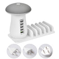 White mushroom-shaped USB charging dock station with five ports and a built-in LED night lamp on a desk.