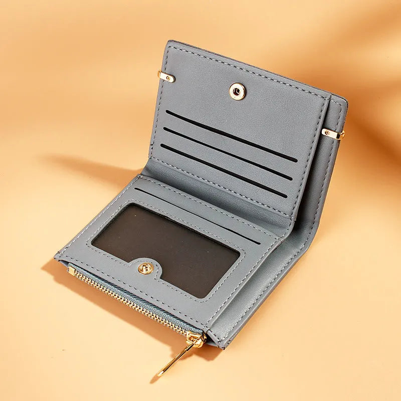 A two-fold PU leather ladies wallet with a zipper, shown in multiple colours, displaying internal card slots and compartments.