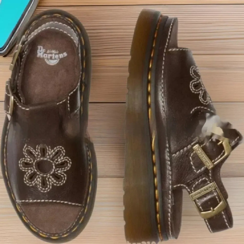 Men's black embroidered beach sandals with flower pattern showing flat heel and PU upper material