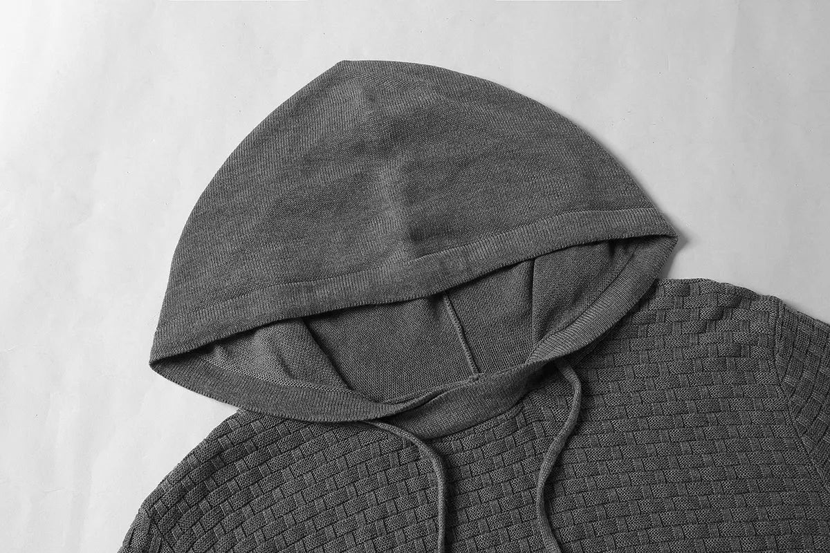 Men's black cotton-polyester blend hooded sweatshirt laid flat, showing front design and hood.
