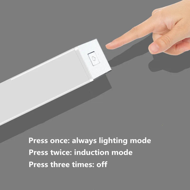 Silver aluminium LED closet light with magnetic back, shown illuminating a wardrobe interior.