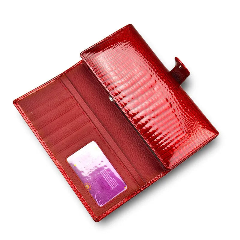 Wine red women's leather coin purse with a shiny crocodile pattern texture and open interior.
