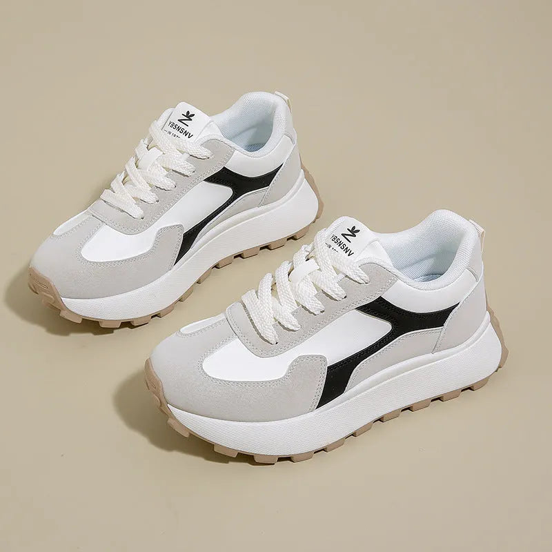 Women's low-top platform sports shoes in solid colours with lace-up front and mesh lining.