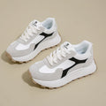 Women's low-top platform sports shoes in solid colours with lace-up front and mesh lining.