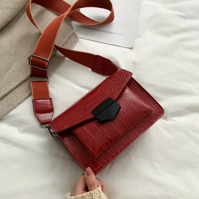 Vintage-style black PU leather crossbody bag with dimensions 20cm by 14cm by 7cm.