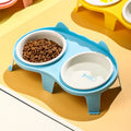 Blue ceramic cat food and water bowl set on a white elevated stand with storage hook