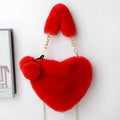 A soft plush heart-shaped women's handbag with a zipper and a detachable shoulder strap in a choice of 14 colours.
