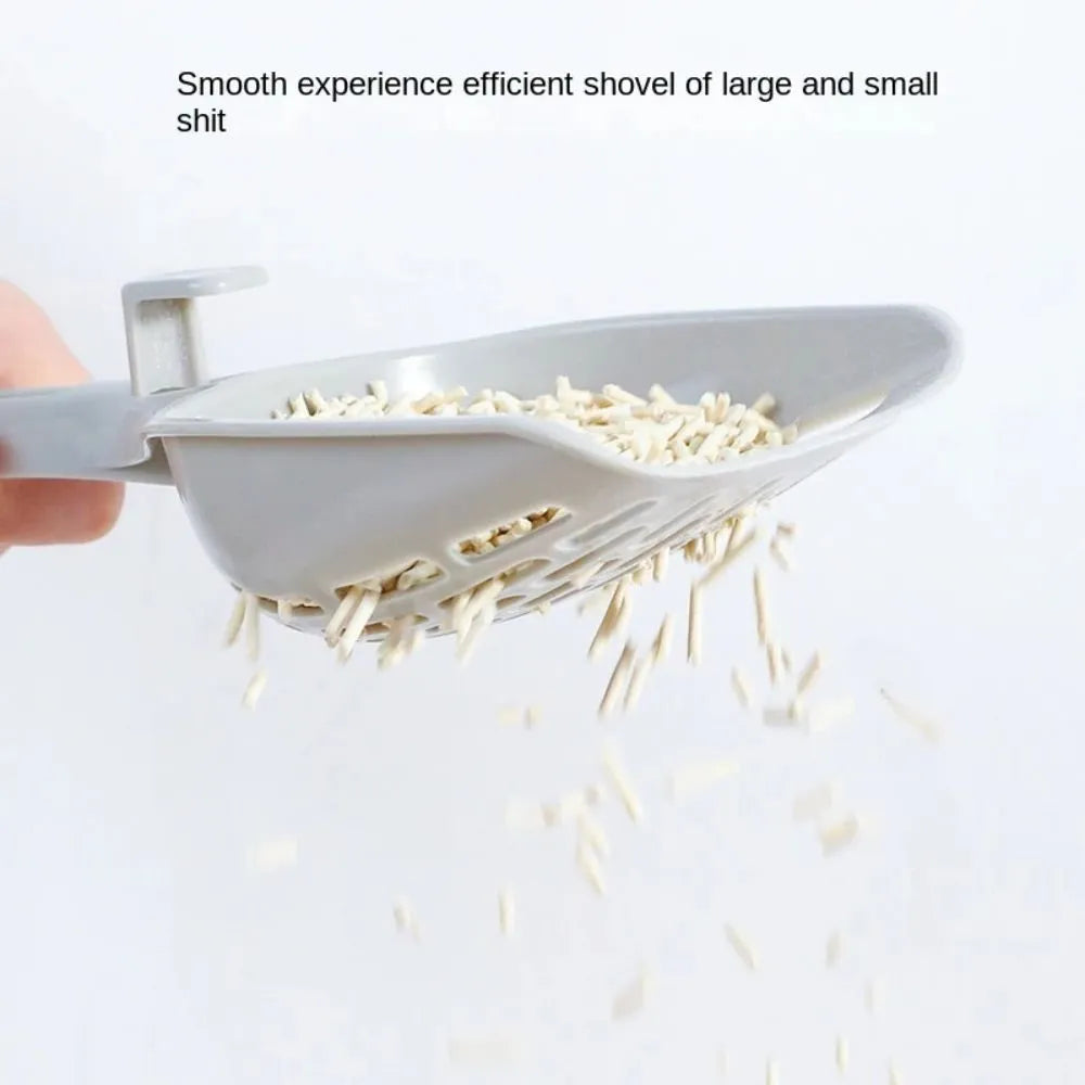 Grey plastic cat litter scoop with attached storage base for litter box cleaning