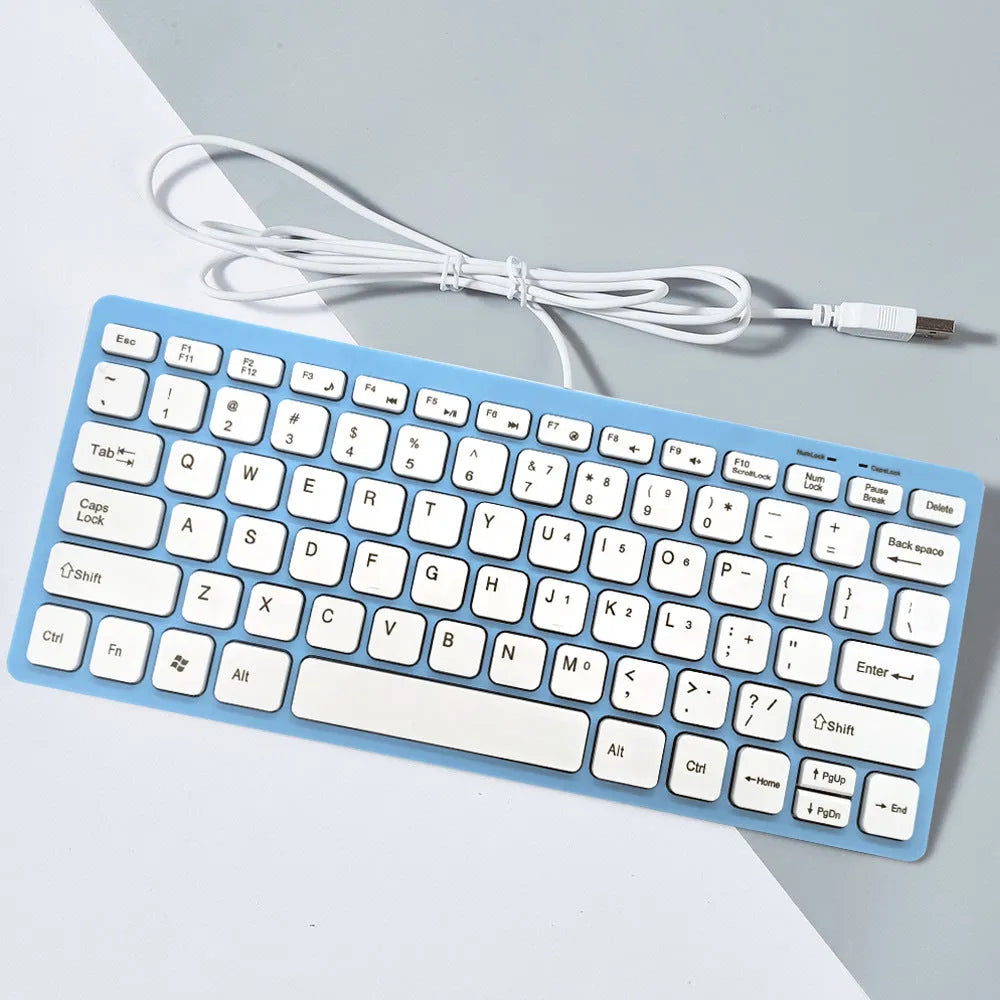Compact black wired USB keyboard with noiseless keys on a desk.