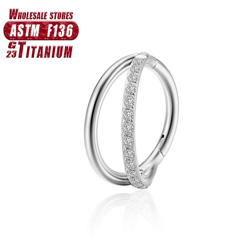Titanium alloy fork nose ring for body piercing in silver colour on a grey background.