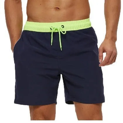 Men's blue fitness shorts with stitching waist detail, drawstring, and multiple pockets for gym workouts