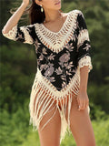 Women's apricot-coloured sun protection blouse with V-neck and long sleeves featuring a hollow-out pattern.