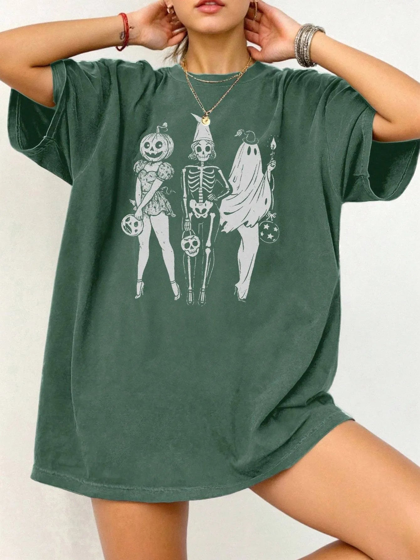 Loose fit cotton short sleeve T-shirt in black, green, grey, or orange on a hanger