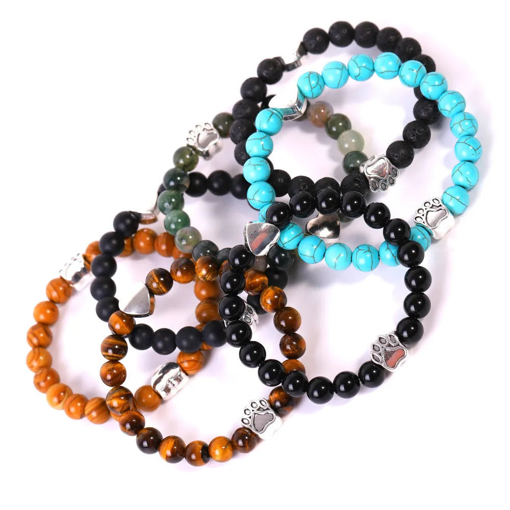 Tigereye Indian Agate stone bracelet with dog paw and love heart charms on wrist.