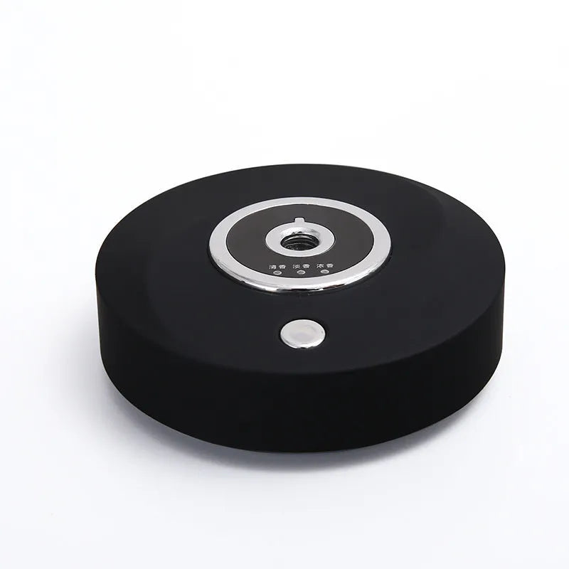 Intelligent vehicle mounted spray accessories in black plastic with USB charging cable and anti slip pad for car aromatherapy