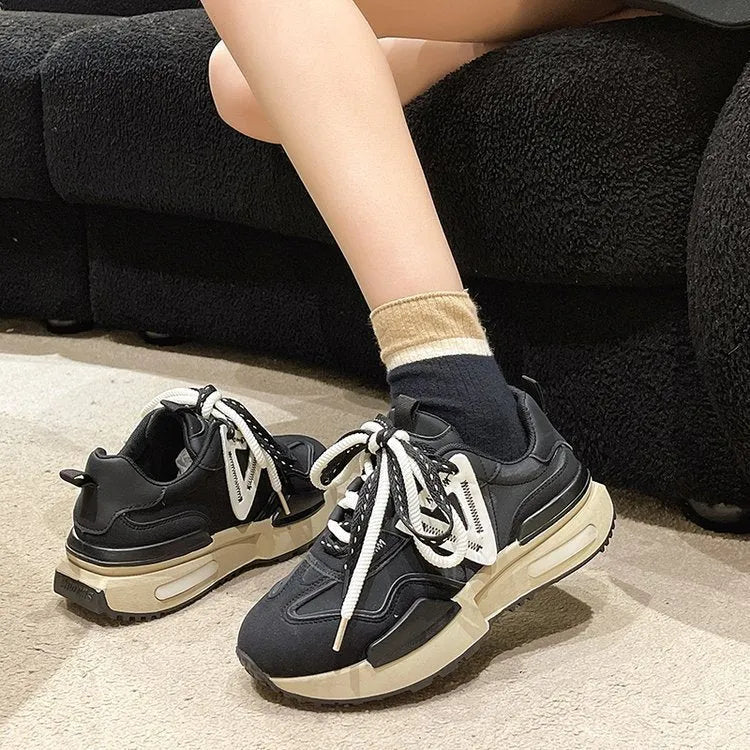 Women's black retro platform sports shoes with round toe and lace-up front on a rubber sole.