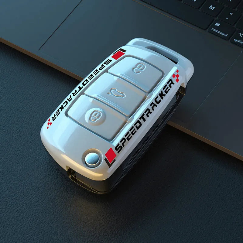 Carbon fibre style car key holder cover in white and carbon colour options with a small mirror.