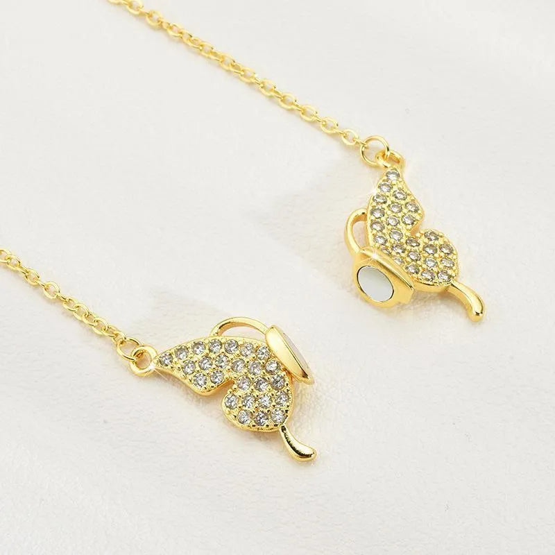Women's butterfly charm clavicle necklace with twisted chain and magnetic closure in gold or silver titanium steel