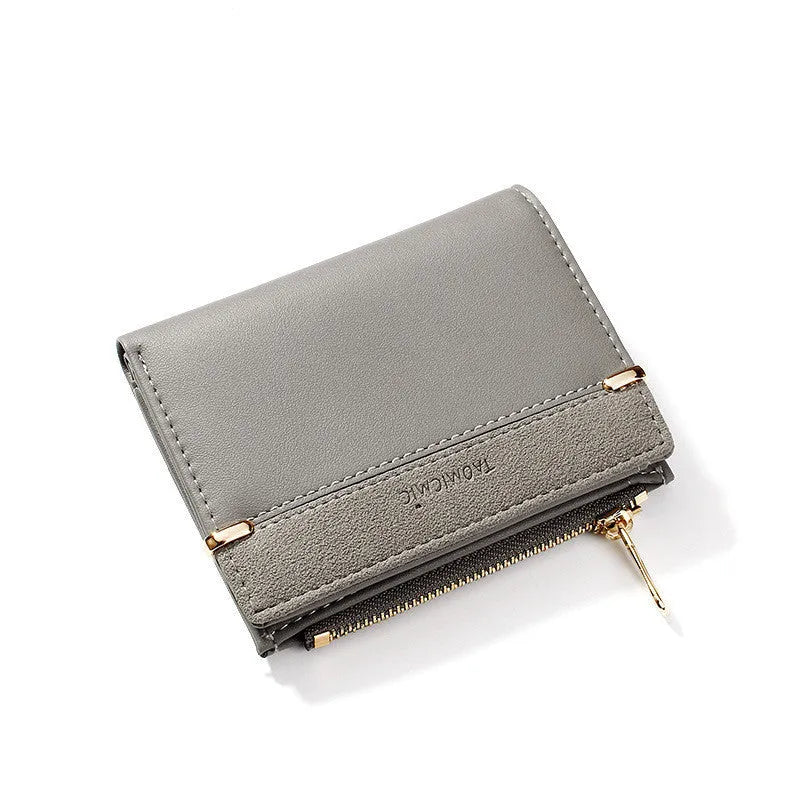 A two-fold PU leather ladies wallet with a zipper, shown in multiple colours, displaying internal card slots and compartments.