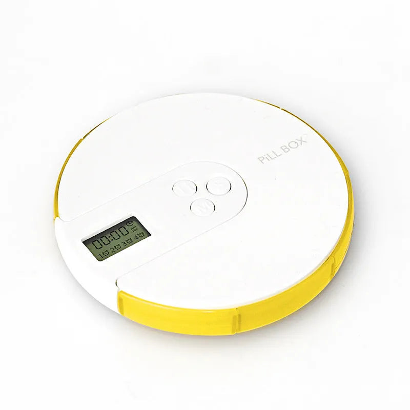 Blue 7-compartment alarm clock pill dispenser showing digital display and pill slots.