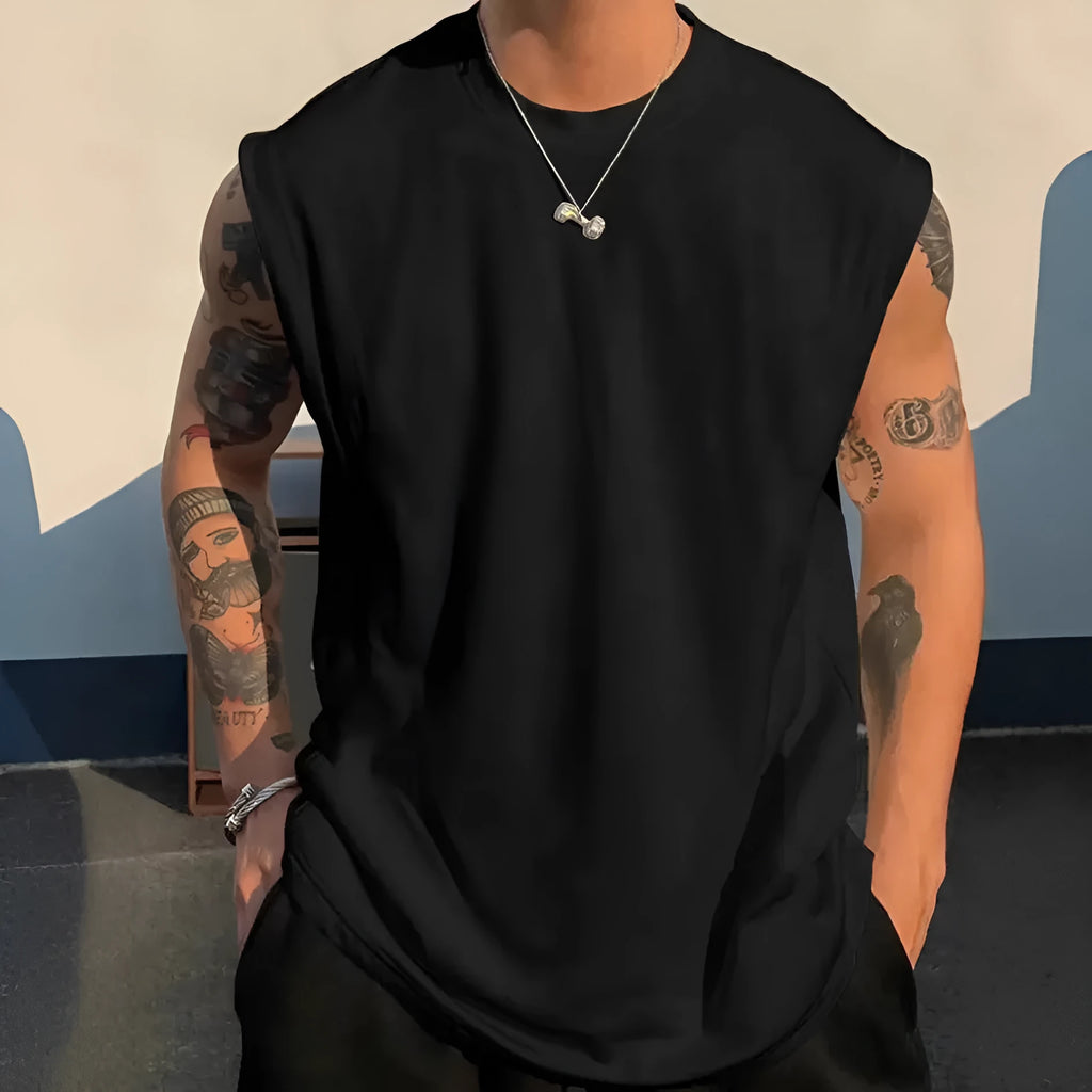 Men's loose cotton tank top in dark grey showing straight hem design and sleeveless construction