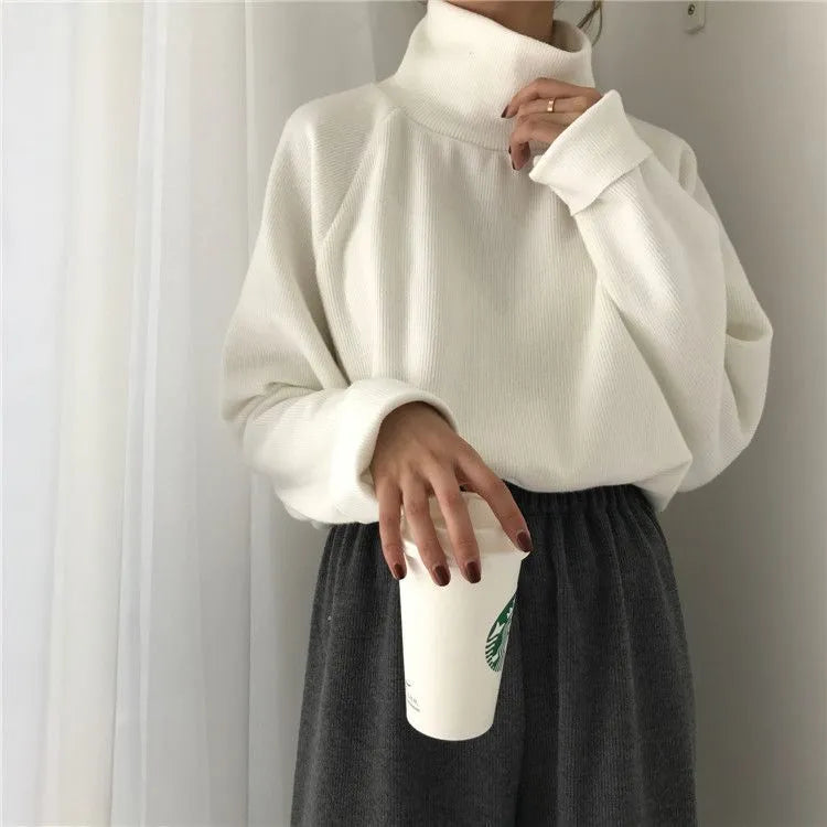 Women's pure colour half-high collar long sleeve loose top in apricot, white, or black.