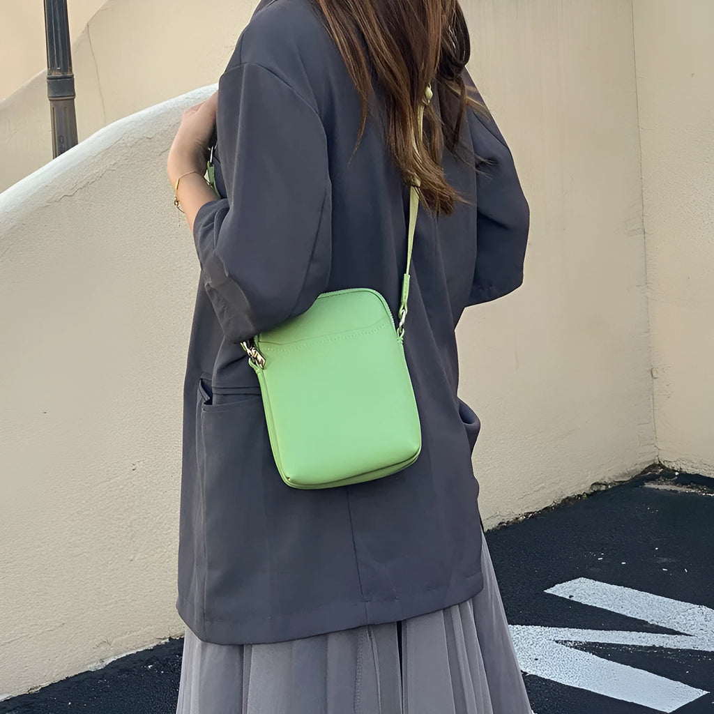Small solid-colour PU crossbody shoulder bag for mobile phone.