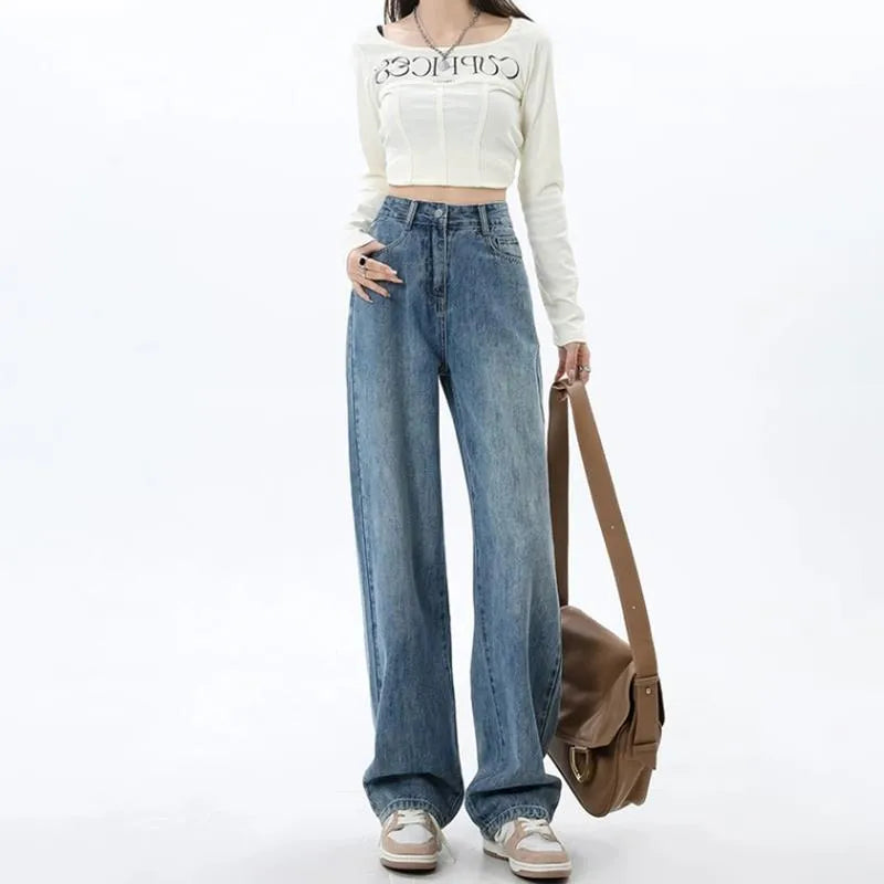 Women's retro blue high-waist wide-leg jeans laid flat, showing straight leg cut and denim texture.