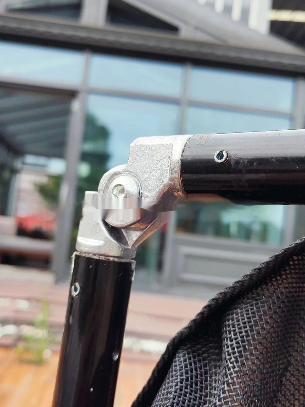 Large black aluminium alloy foldable pet stretcher for emergency dog transfer and rescue.