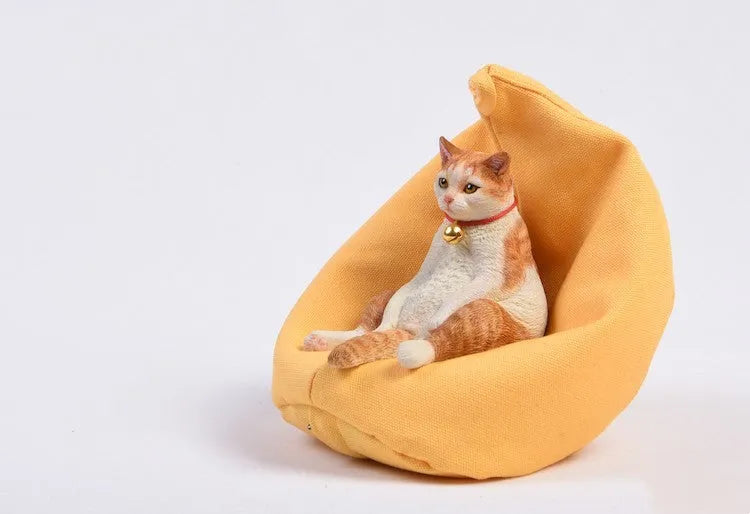 Lazy cat resin car dashboard ornament with sofa, 7.5cm tall