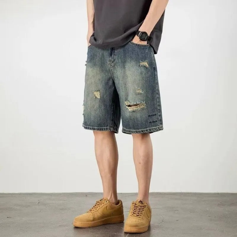 Blue retro denim men's shorts with distressed holes and straight leg cut