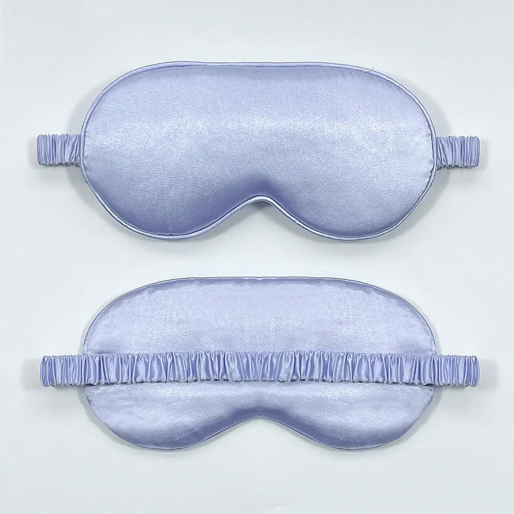 Double-sided Rayon elastic satin sleep mask shown in multiple colour options including sky blue, black, wine red, and light pink.