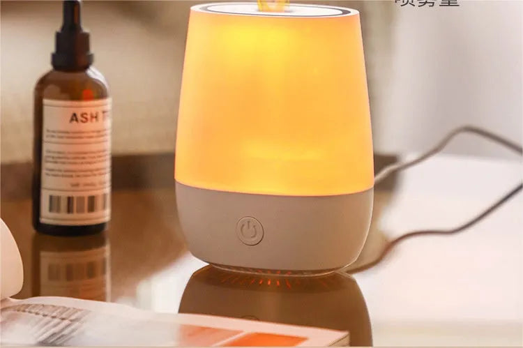 White USB aroma diffuser with simulated flame effect and compact design for bedside use