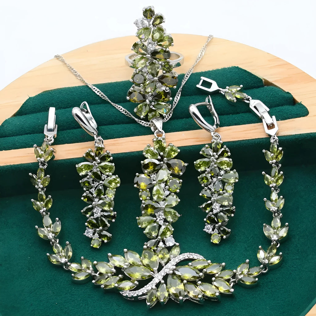 Complete retro floral jewellery set in copper with zircon stones, showing necklace, bracelet, earrings, and ring in olive green finish.
