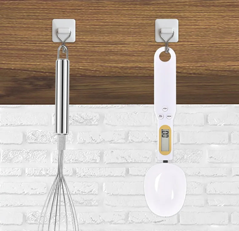 Black electronic measuring spoon scale showing digital display, 23.2cm long.