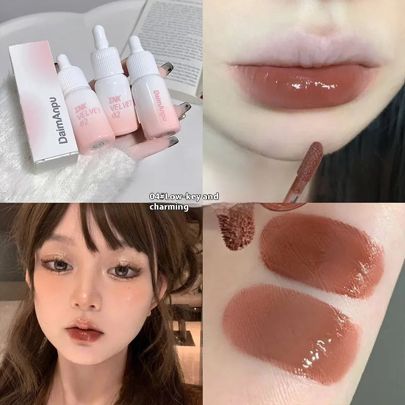 Mirror Lip Lacquer lip gloss tube in one of four shades: Spring Day Wilderness, Orange Tabby Cat Diary, Low-key Charming, or Misty Berry.