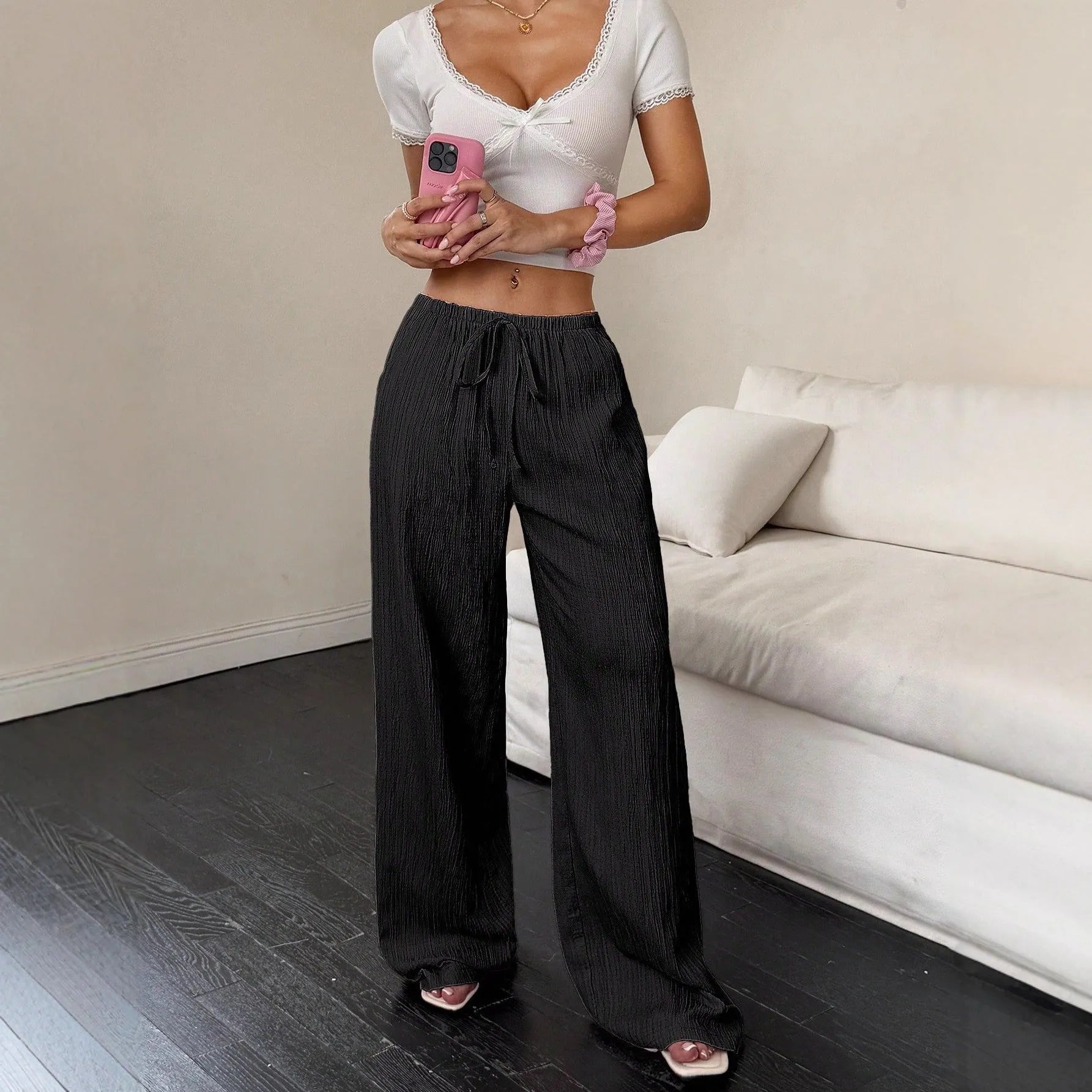Women's wide-leg trousers with lace-up waist trimming in black and pink polyester fabric