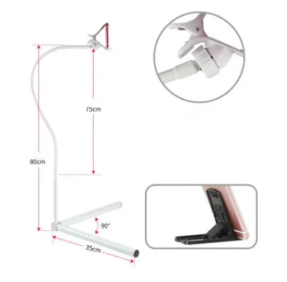 Black bedside phone holder with universal mobile phone bracket and adjustable overhead support shelf positioned next to bed