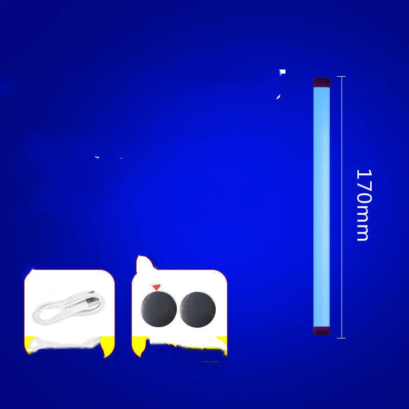 Rechargeable dimmable LED tube light in blue and purple colours shown in a bedroom setting.