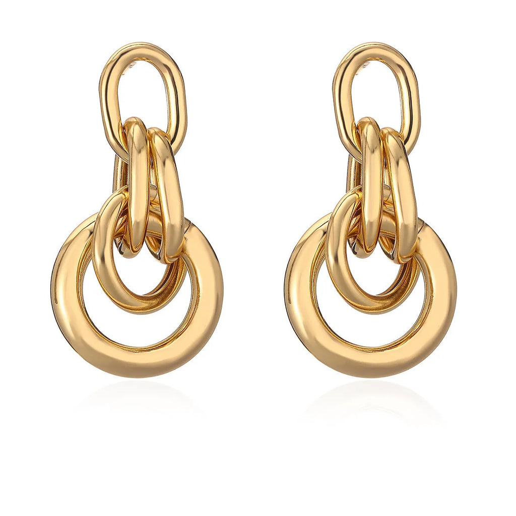 Geometric irregular-shaped copper earrings for women with a real gold colour finish.