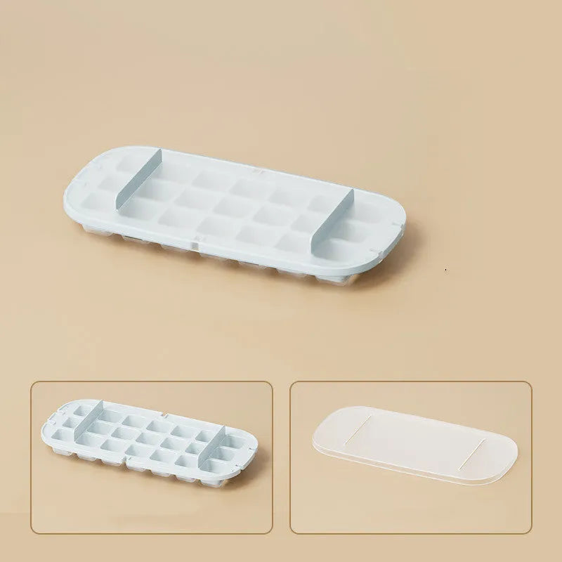 Blue high-capacity ice cube tray with integrated storage for an ice shovel.