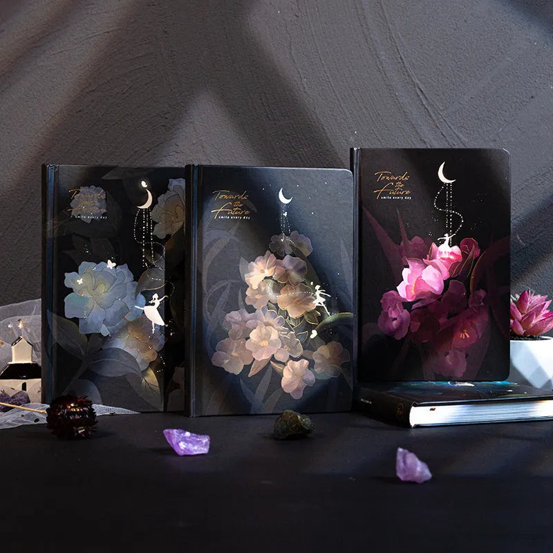 A5 notebook with a luminous cover in one of four colours, open to show pages with colour illustrations
