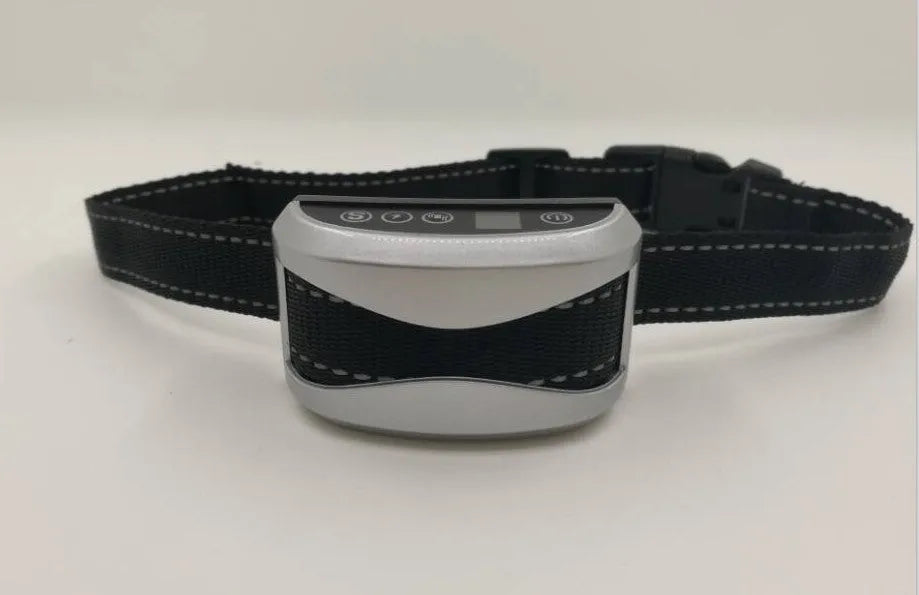 Electronic dog bark collar with digital display and adjustable black nylon strap.
