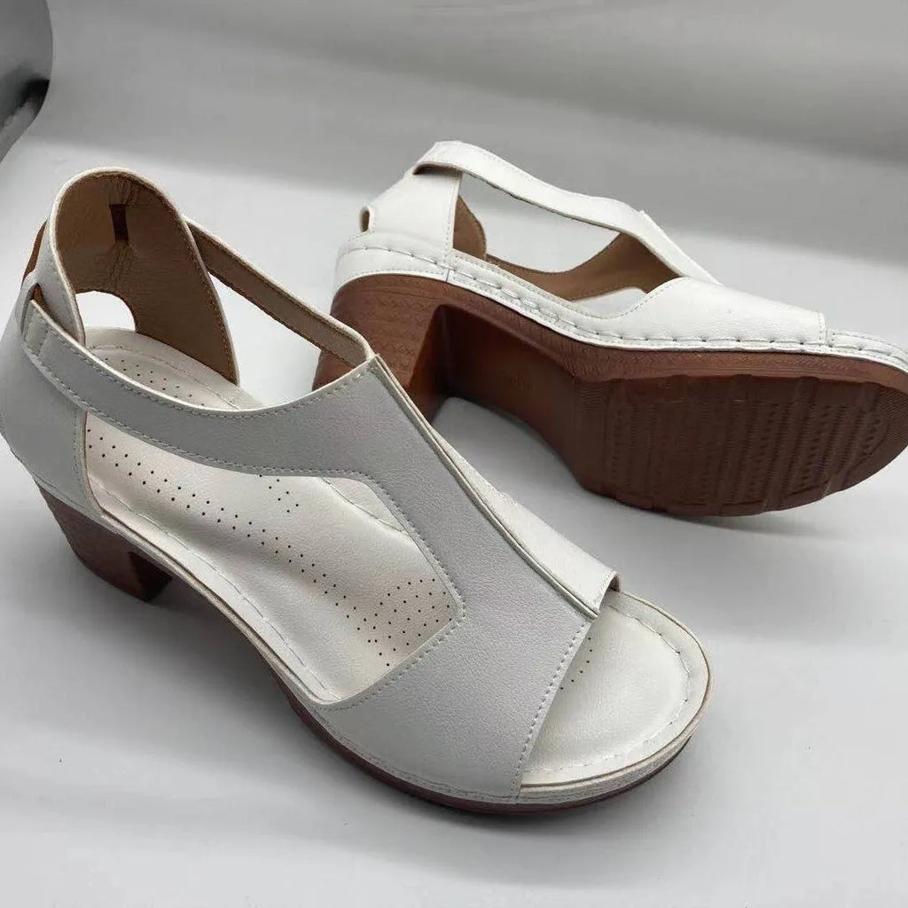 Women's peep toe wedge sandals with a buckle strap, shown in a light brown colour on a white background.