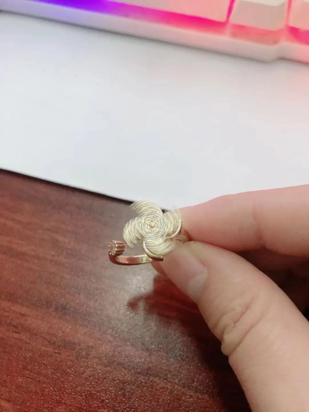 Rotating windmill ring with micro-inlaid design in gold or silver electroplated finish